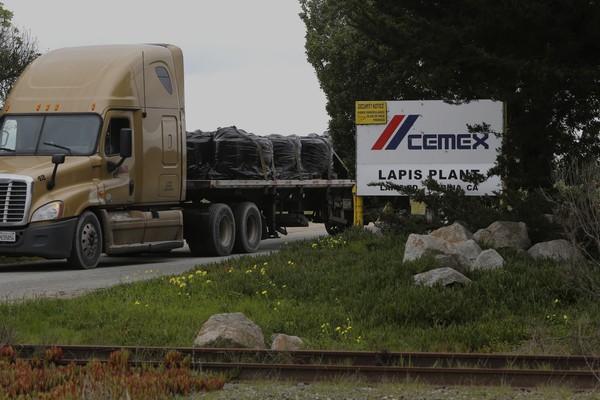 A truck leaves the the Cemex lapis plant