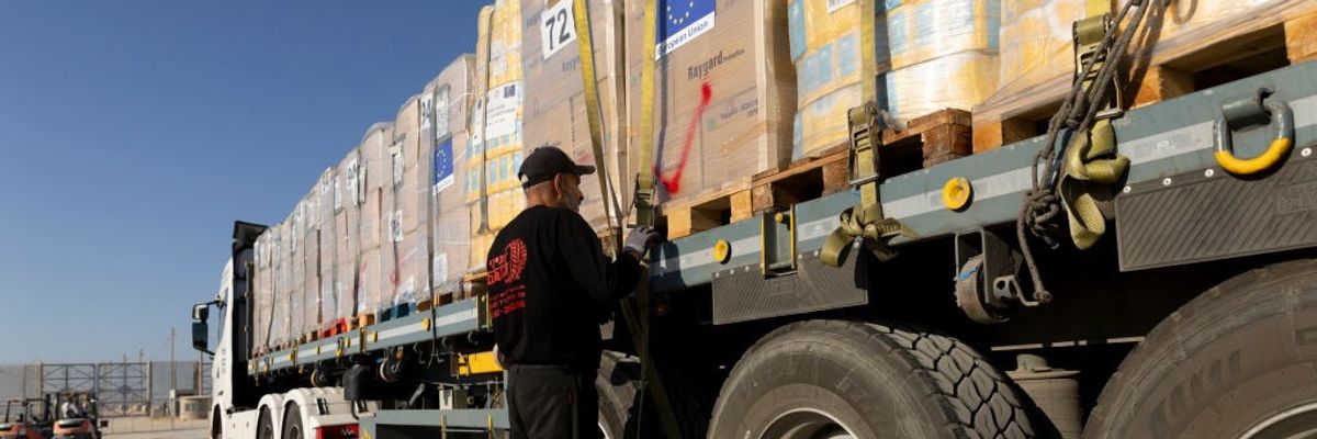A truck loaded with humanitarian aid waits to enter Israel