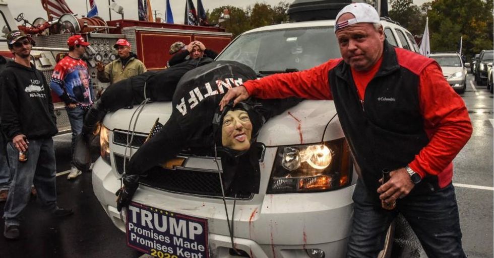 A Trump supporter with an effigy of a dead Antifa person on his car attends a pro-Trump rally on November 1, 2020 in West Nyack, New York. (Photo: Stephanie Keith/Getty Images)