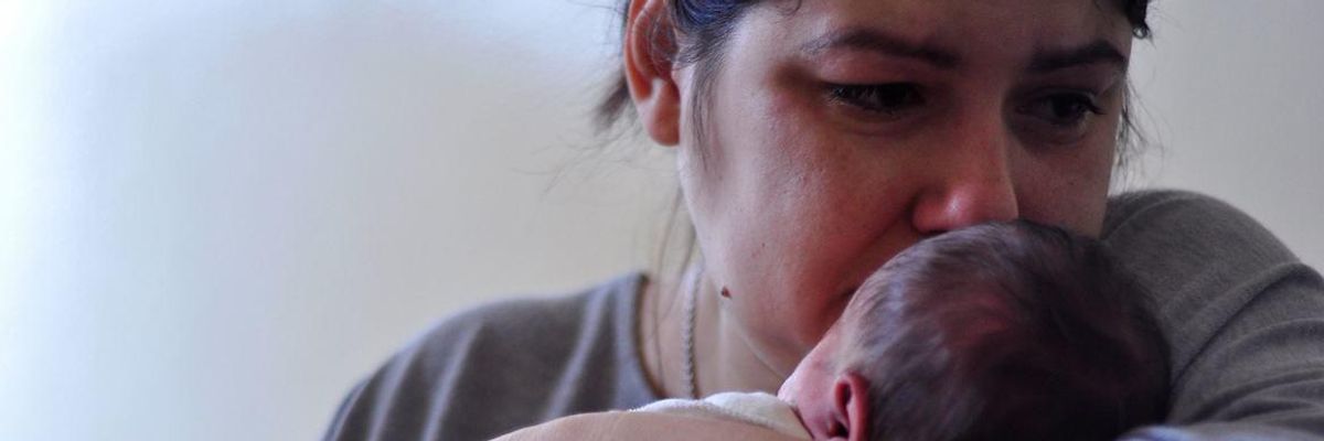 A Ukrainian mother holds her child
