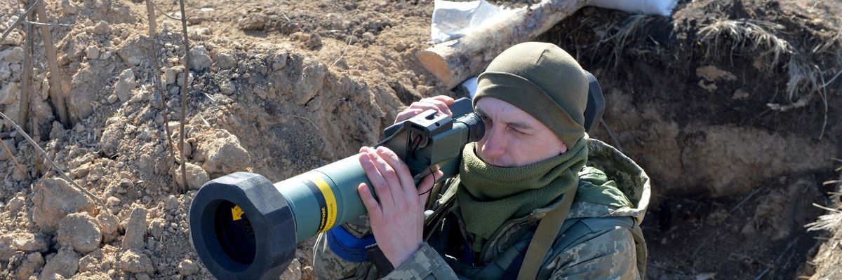 A Ukrainian servicemember hold an anti-tank weapon