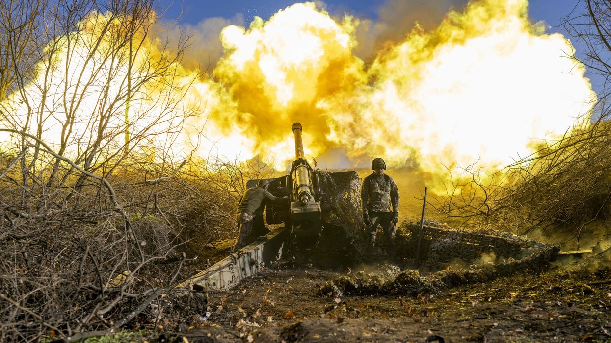 A Ukrainian soldier of an artillery unit fires towards Russian positions outside Bakhmut in November of 2022
