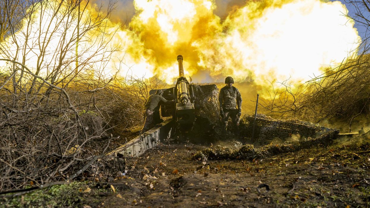A Ukrainian soldier of an artillery unit fires towards Russian positions outside Bakhmut in November of 2022