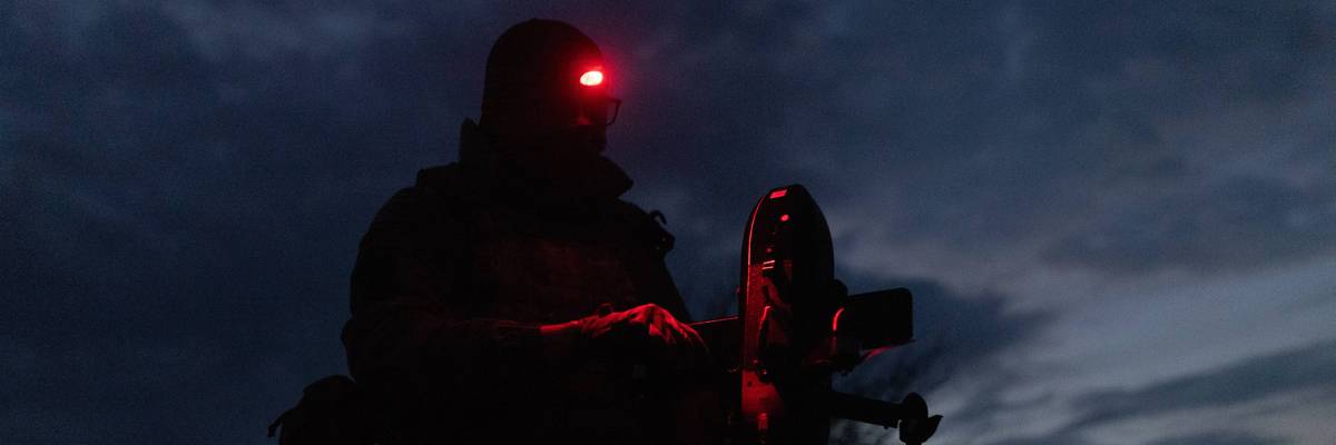 A Ukranian soldier prepares a drone.