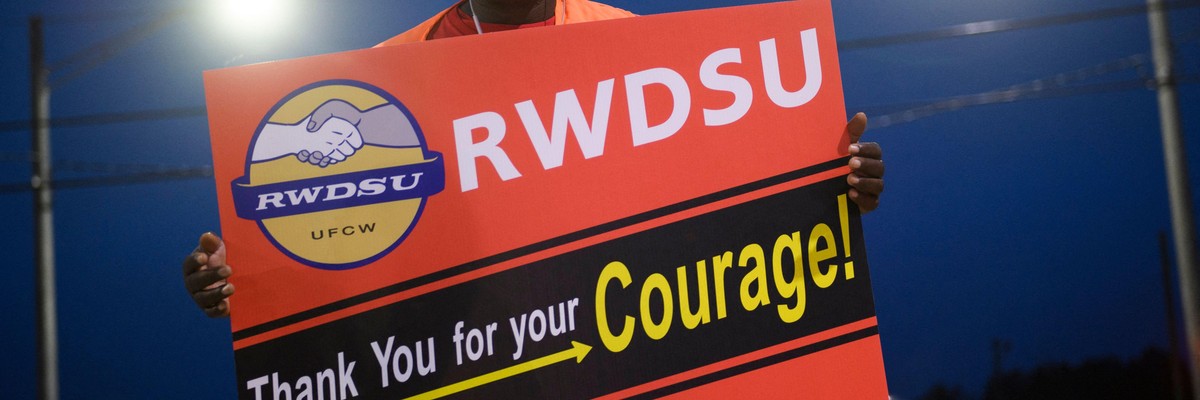 A union organizer stands outside an Amazon fulfillment center on March 27, 2021 in Bessemer, Alabama.