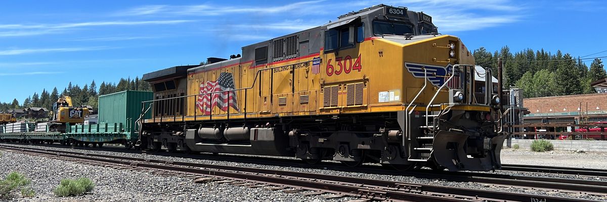 A Union Pacific locomotive pulls railcars