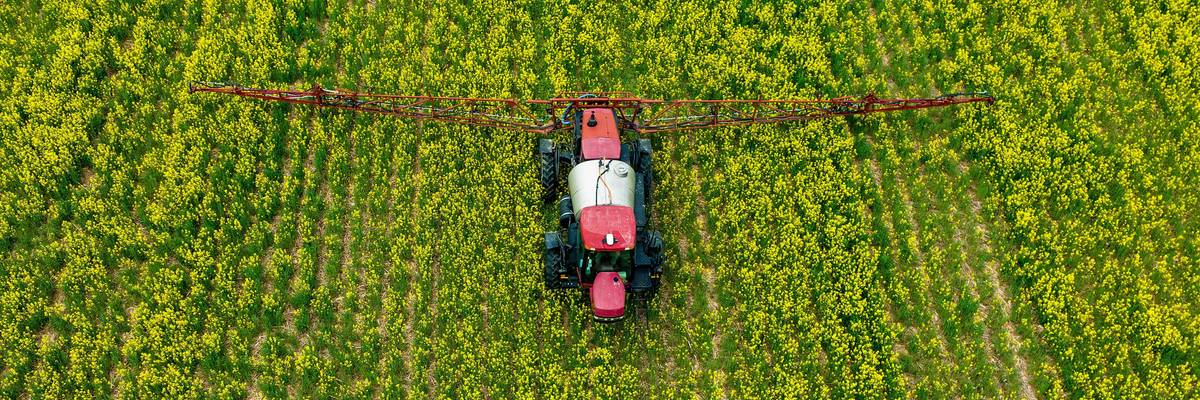 A US farmer spreads pesticides on a field.