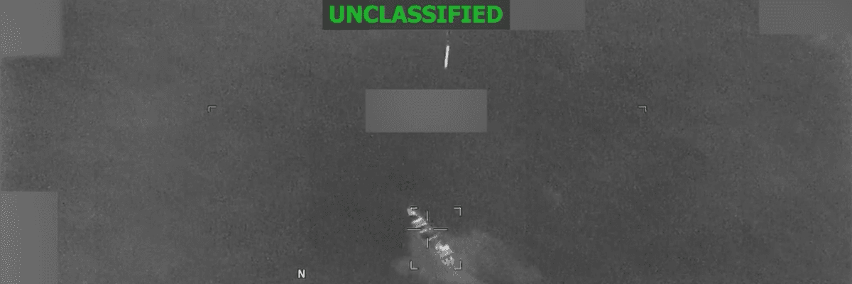 A US munition falls toward a boat in the Pacific Ocean in this grainy Pentagon video marked "unclassified"
