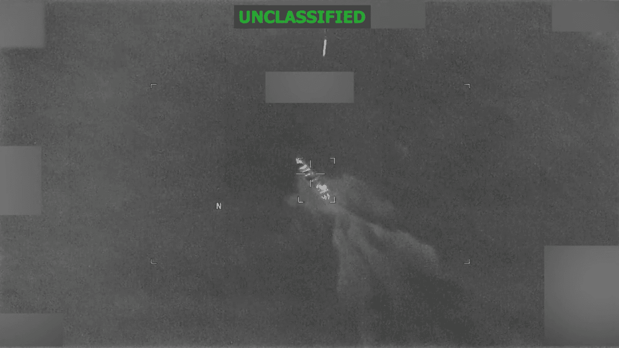 A US munition falls toward a boat in the Pacific Ocean in this grainy Pentagon video marked "unclassified"