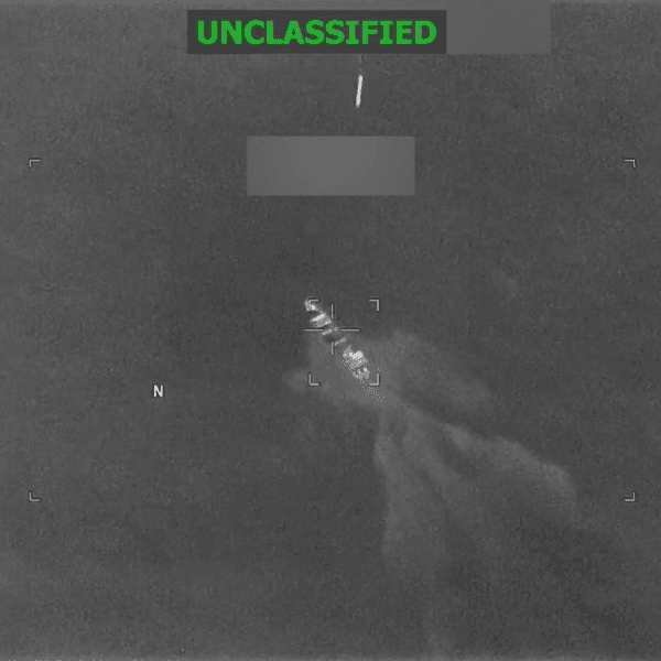 A US munition falls toward a boat in the Pacific Ocean in this grainy Pentagon video marked "unclassified"