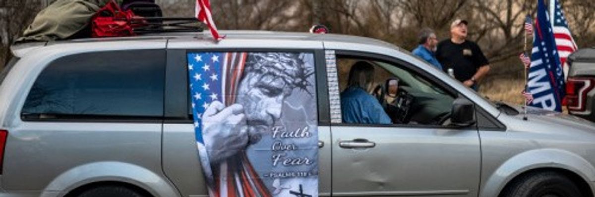 A van in the Take Back the Border convoy sports a barbed-wired Christ urging "Faith over Fear"