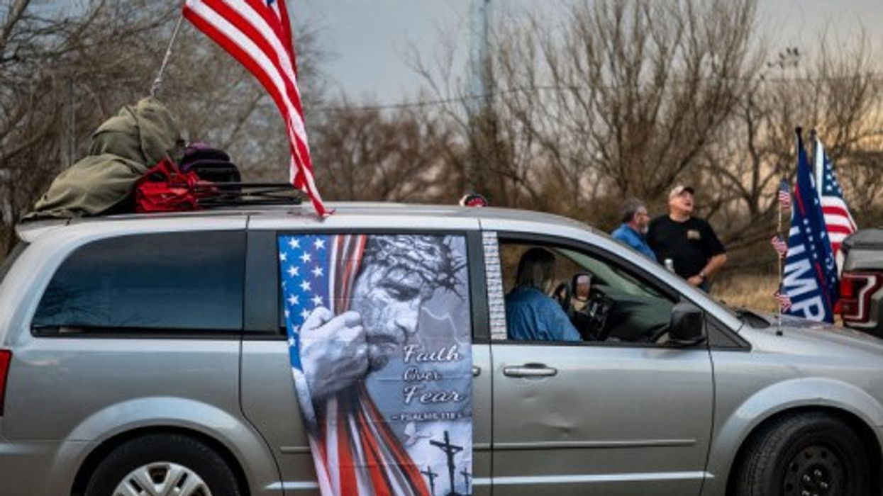 A van in the Take Back the Border convoy sports a barbed-wired Christ urging "Faith over Fear"