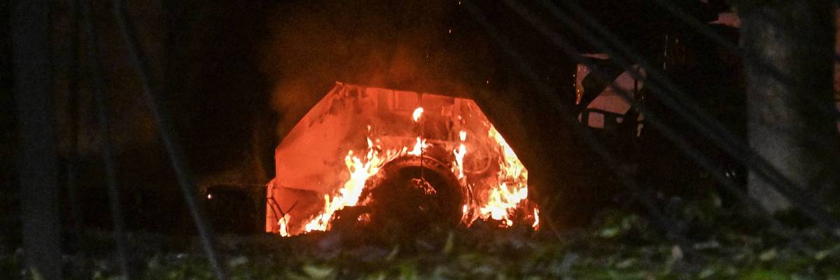 A vehicle burns in Trump's attack on Caracas, Venezuela.
