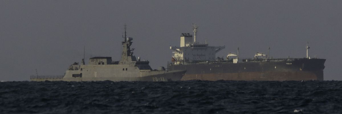 A Venezuelan navy patrol boat escorts Panamanian flagged crude oil tanker Yoselin