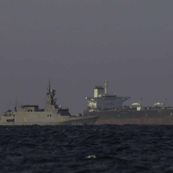 A Venezuelan navy patrol boat escorts Panamanian flagged crude oil tanker Yoselin