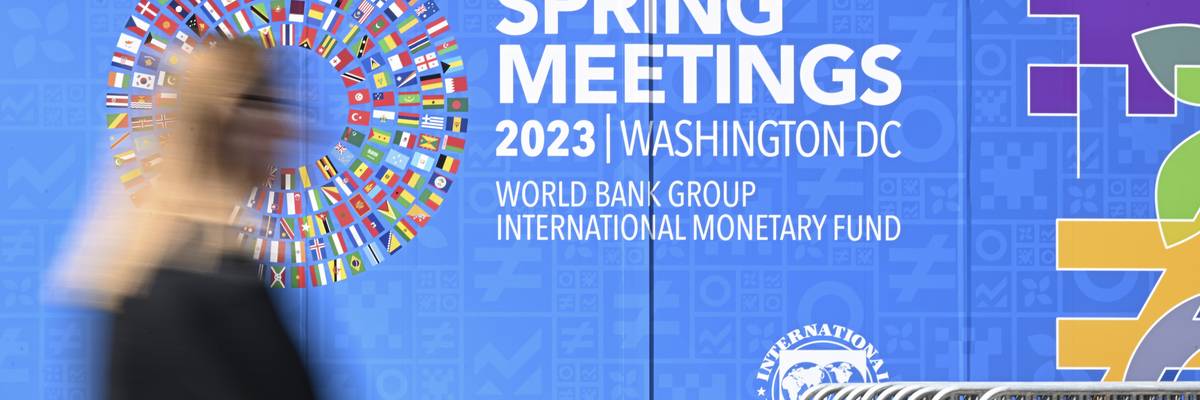 A view of the sign for the 2023 Spring Meetings of the World Bank and International Monetary Fund