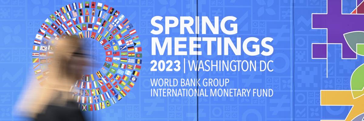 A view of the sign for the 2023 Spring Meetings of the World Bank and International Monetary Fund