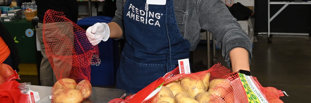 A volunteer attends a Feeding America event
