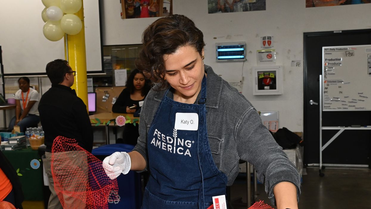 A volunteer attends a Feeding America event