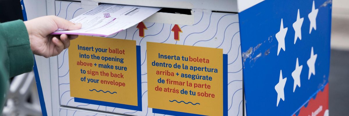 A voter drops off their ballot in Grand Rapids, Michigan