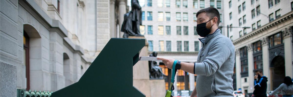 A voter mails in a ballot