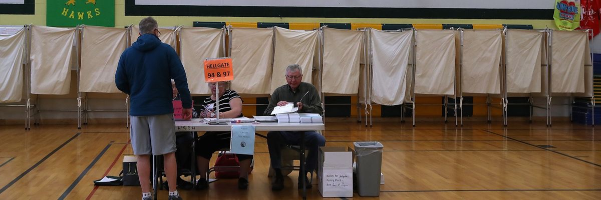 A voter registers in a polling station