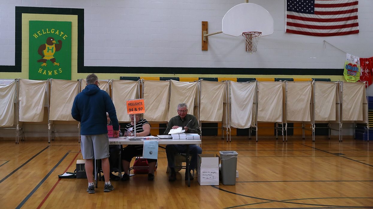 A voter registers in a polling station