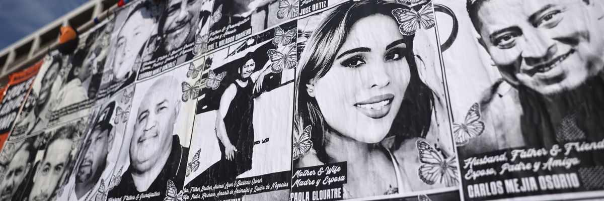 A wall with photos of people targeted by ICE.