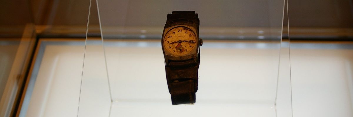 A watch stopped at the time of the Hiroshima bombing in a display case.