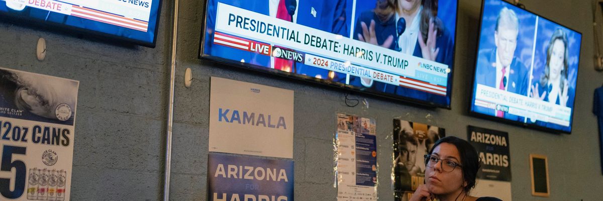 A woman attends a watch party for the U.S. presidential debate