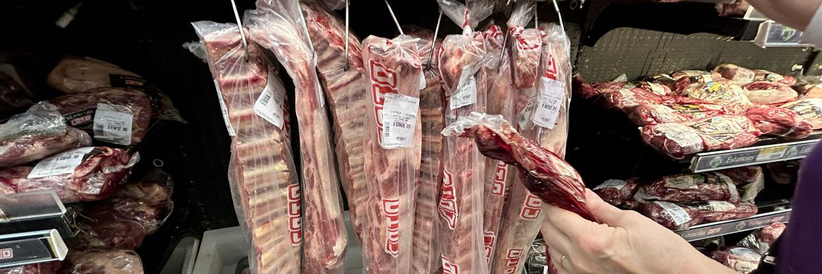 A woman buys beef at a supermarket in Buenos Aires, Argentina on May 2, 2024.