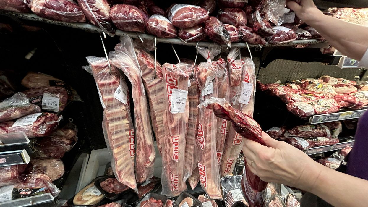 A woman buys beef at a supermarket in Buenos Aires, Argentina on May 2, 2024.