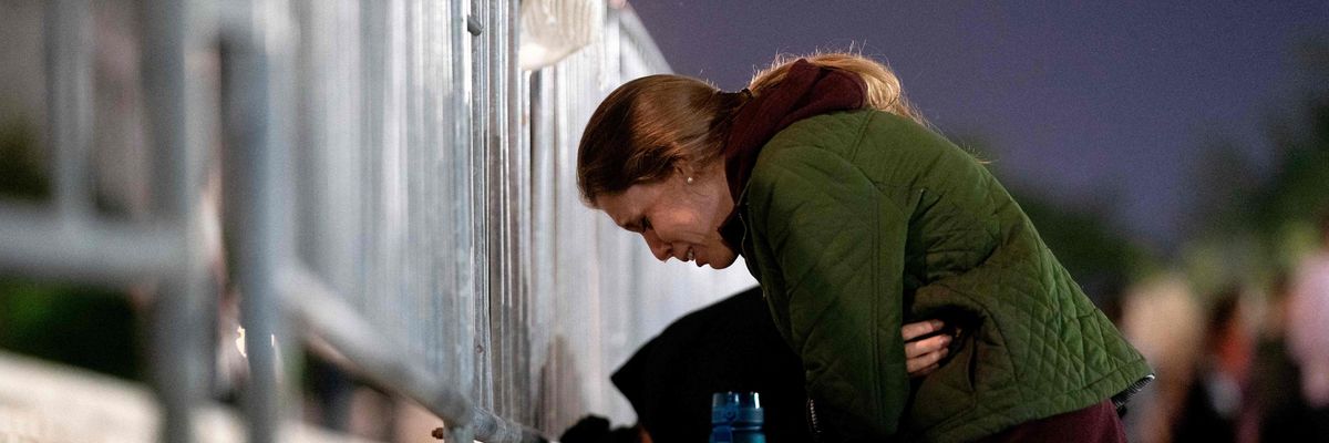 A woman cries in front of Supreme Court