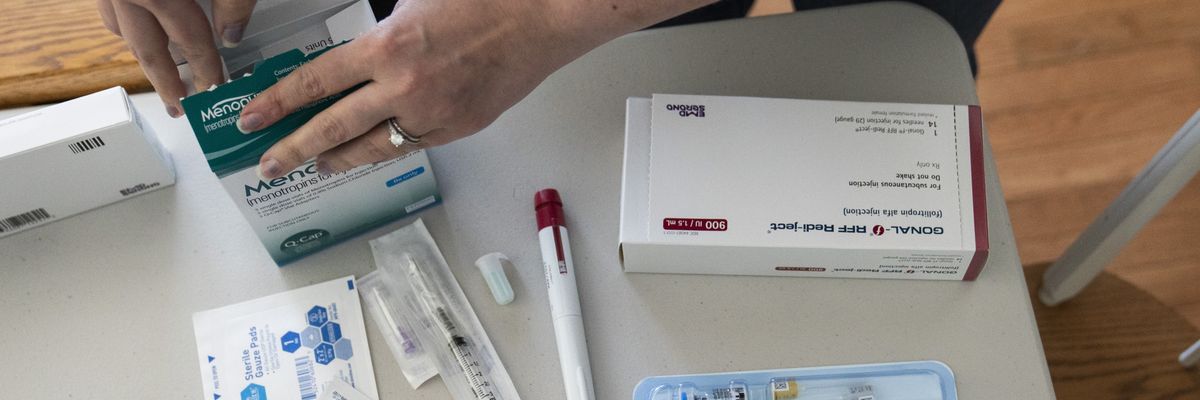 A woman goes through her IVF medications