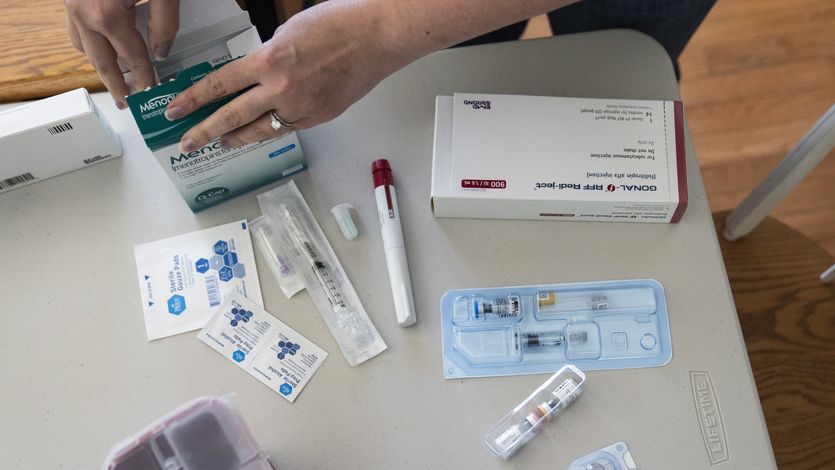 A woman goes through her IVF medications