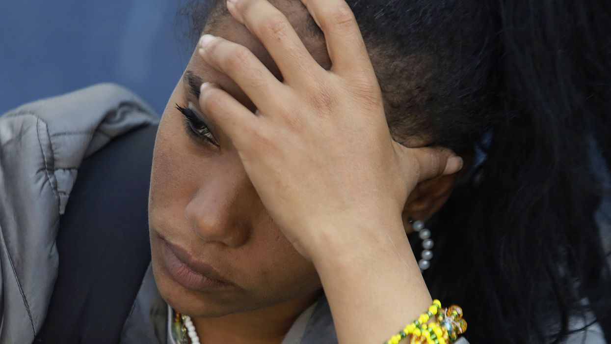 A woman is seen outside the Mexican Commission for Refugee Assistance in Mexico