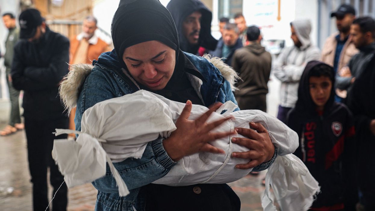 A woman mourns a dead child in Gaza.