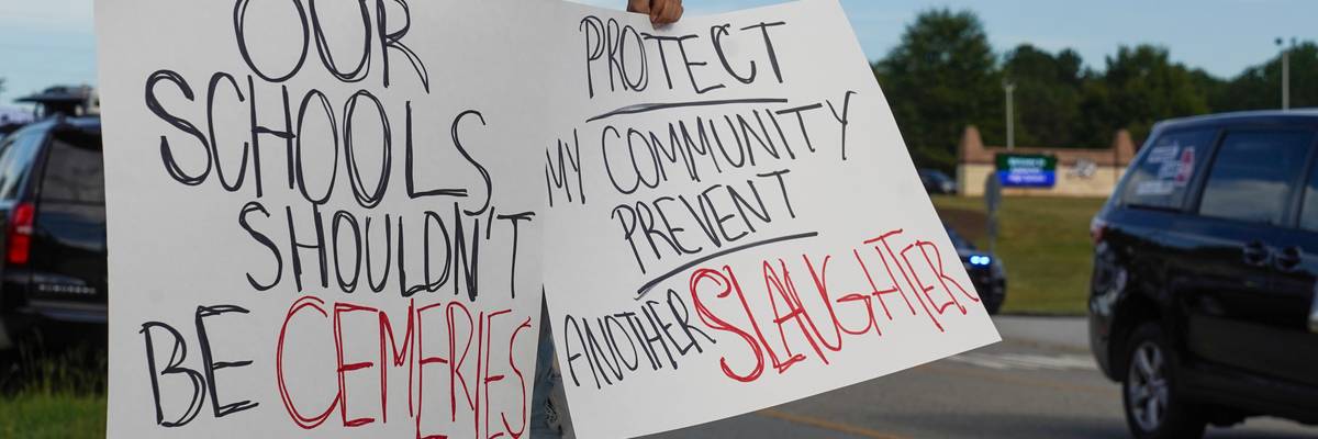 A woman protests after a school shooting at Apalachee High School in Georgia.
