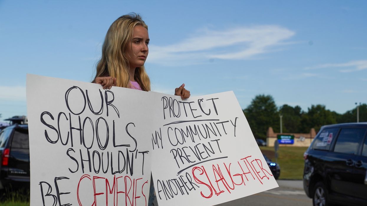 A woman protests after a school shooting at Apalachee High School in Georgia.