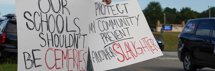 A woman protests after a school shooting at Apalachee High School in Georgia.