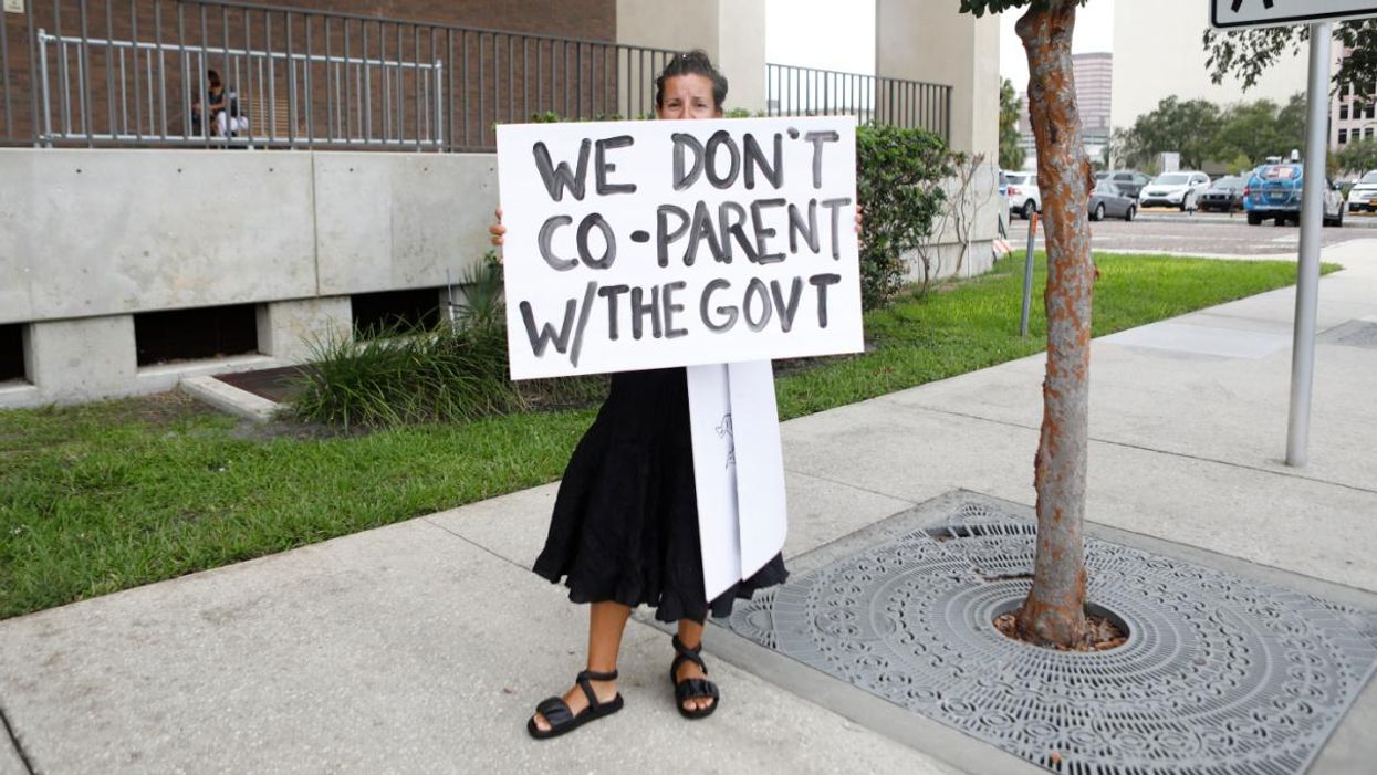 A woman protests mask mandates in Florida.