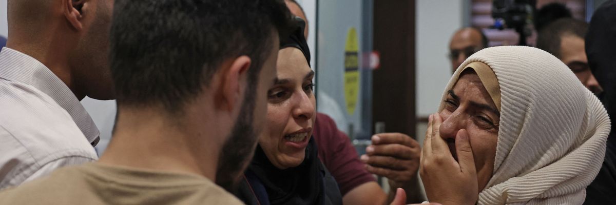 A woman reacts at a hospital in Jenin