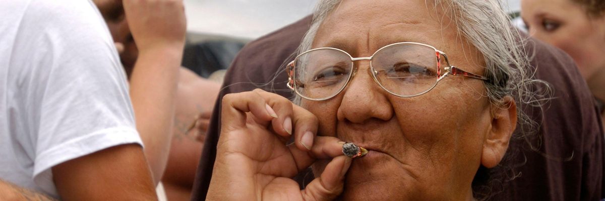 A woman smokes marijuana