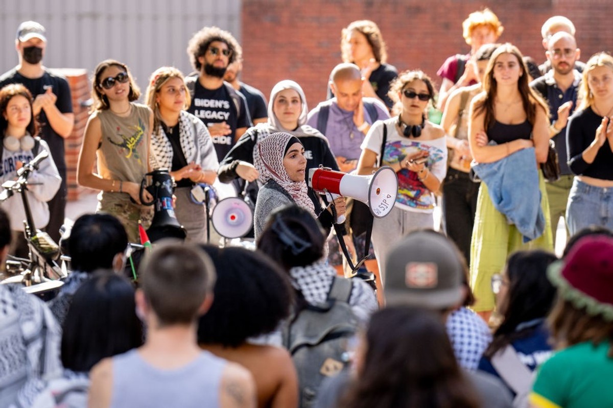 A woman speaks as Georgetown students hold rally opposed to Gaza war