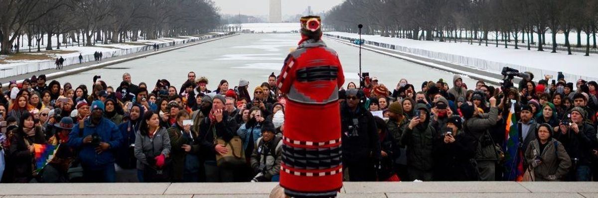 A woman speaks during the Indigenous People's March on the National Mall at the Lincoln Memorial in Washington, DC, on January 18, 2019