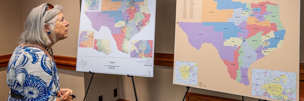 A woman views Texas Republicans' proposed congressional redistricting map