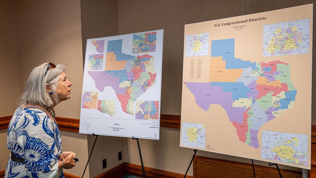 A woman views Texas Republicans' proposed congressional redistricting map