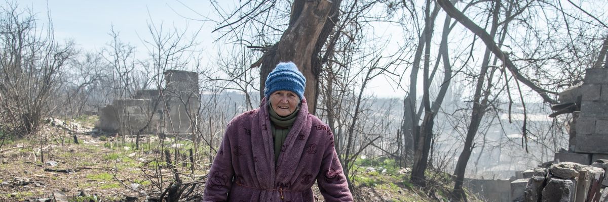 A woman walks on a hill leading down to the Azov Sea in the southern area of Mariupol, Ukraine on April 9, 2022.