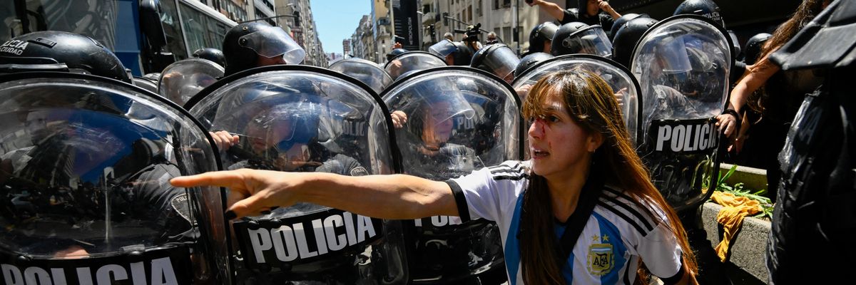 A woman with a bloody face after police violence at Buenos Aires protest