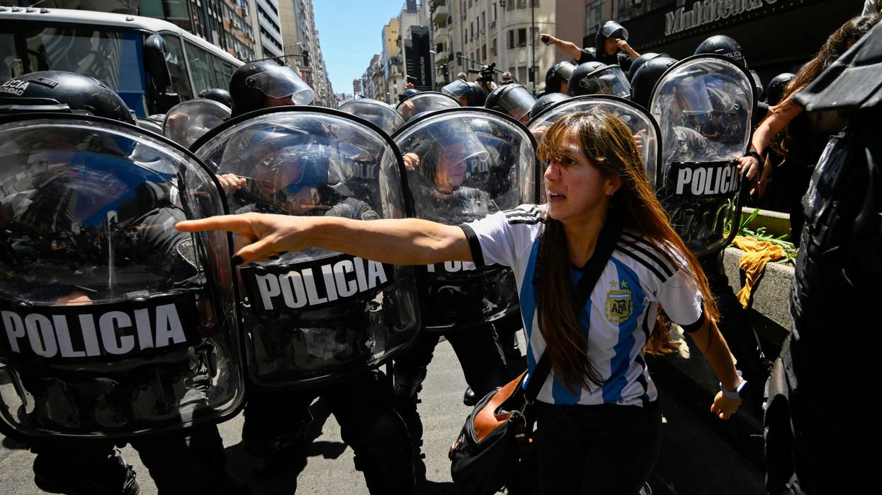 A woman with a bloody face after police violence at Buenos Aires protest